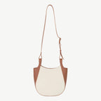 Two-tone brown and white handbag on a white background