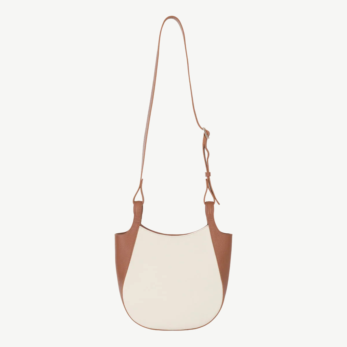 Two-tone brown and white handbag on a white background